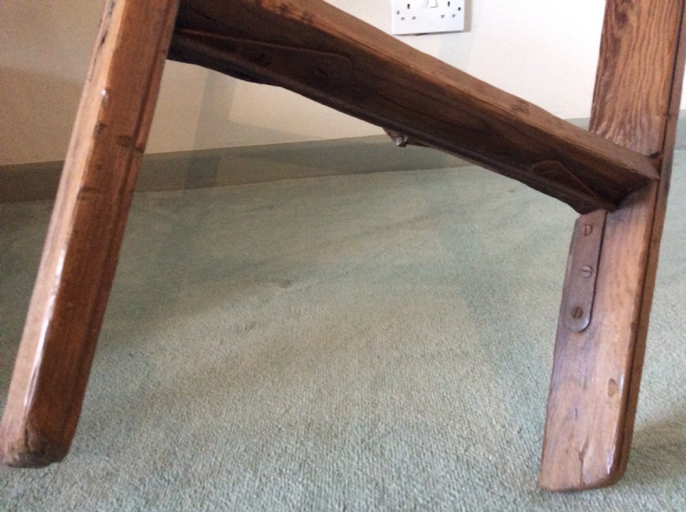 A tall Victorian pine shop ladder featuring straight wooden stiles, flat horizontal rungs, and a top mounting bar. View VII