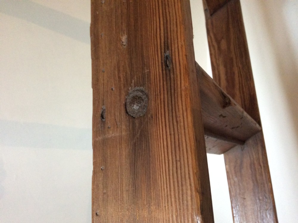 A tall Victorian pine shop ladder featuring straight wooden stiles, flat horizontal rungs, and a top mounting bar. View IX