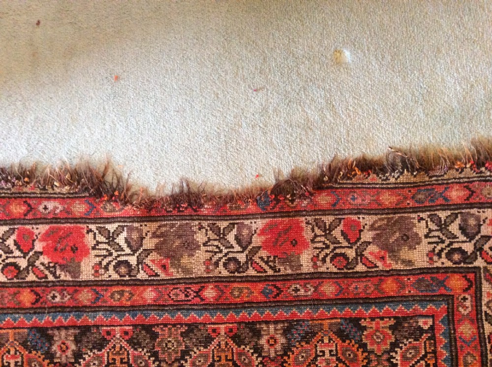A 19thC Caucasian boteh design rug View VII