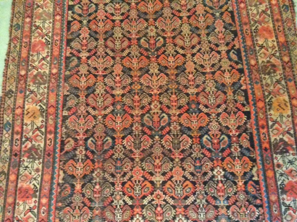 A 19thC Caucasian boteh design rug View IX