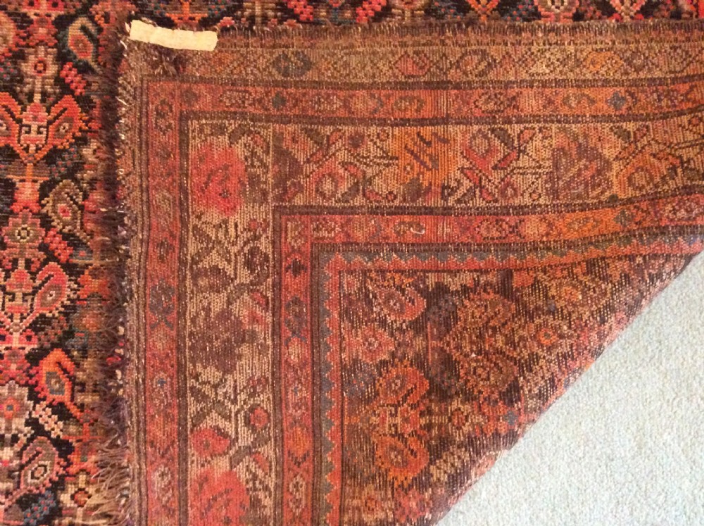 A 19thC Caucasian boteh design rug View X