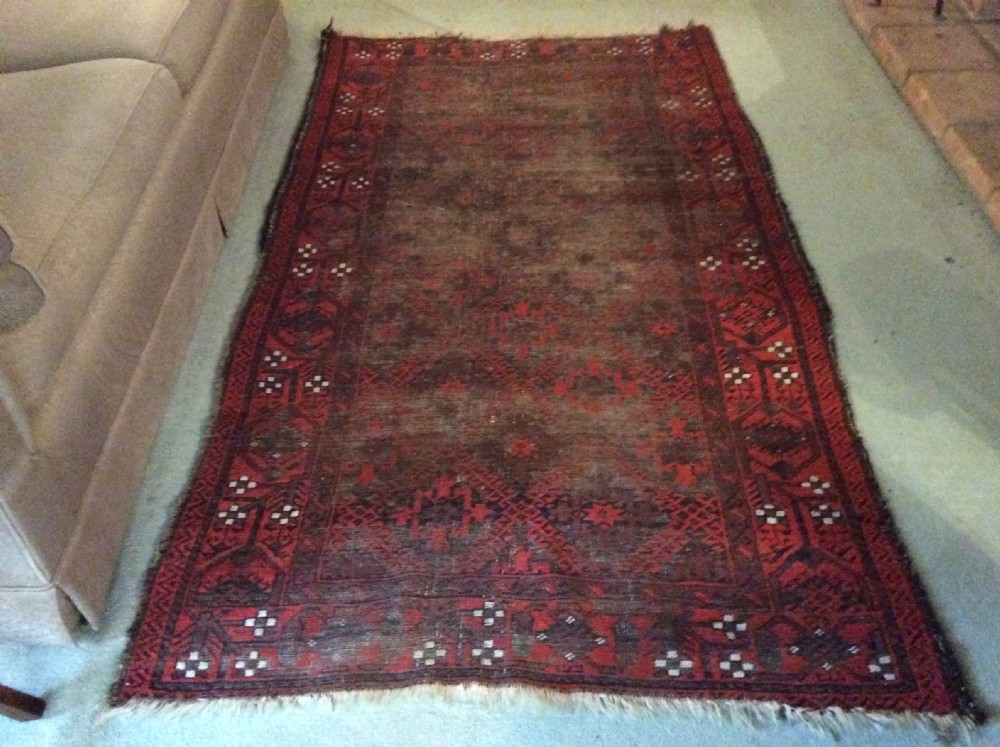 A well worn antique Afgan Baluch rug View II
