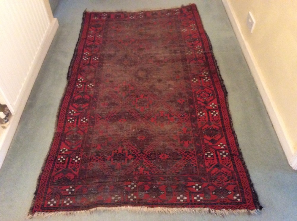 A well worn antique Afgan Baluch rug View VI