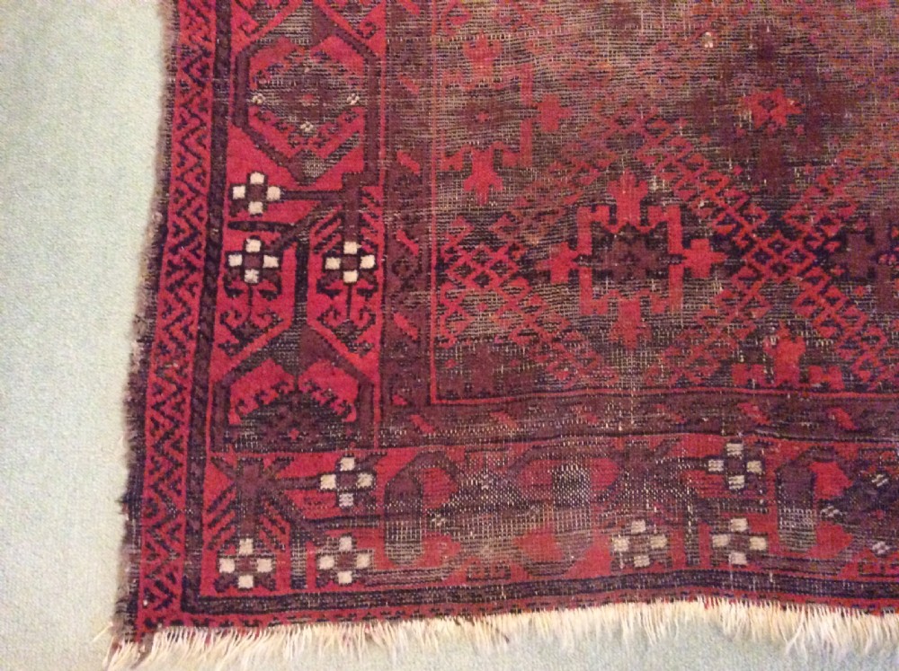 A well worn antique Afgan Baluch rug View VII