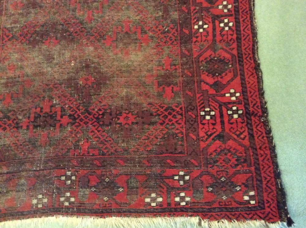 A well worn antique Afgan Baluch rug View VIII