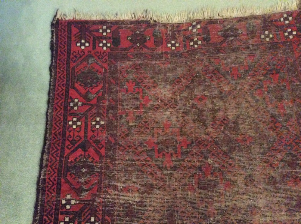A well worn antique Afgan Baluch rug View XI
