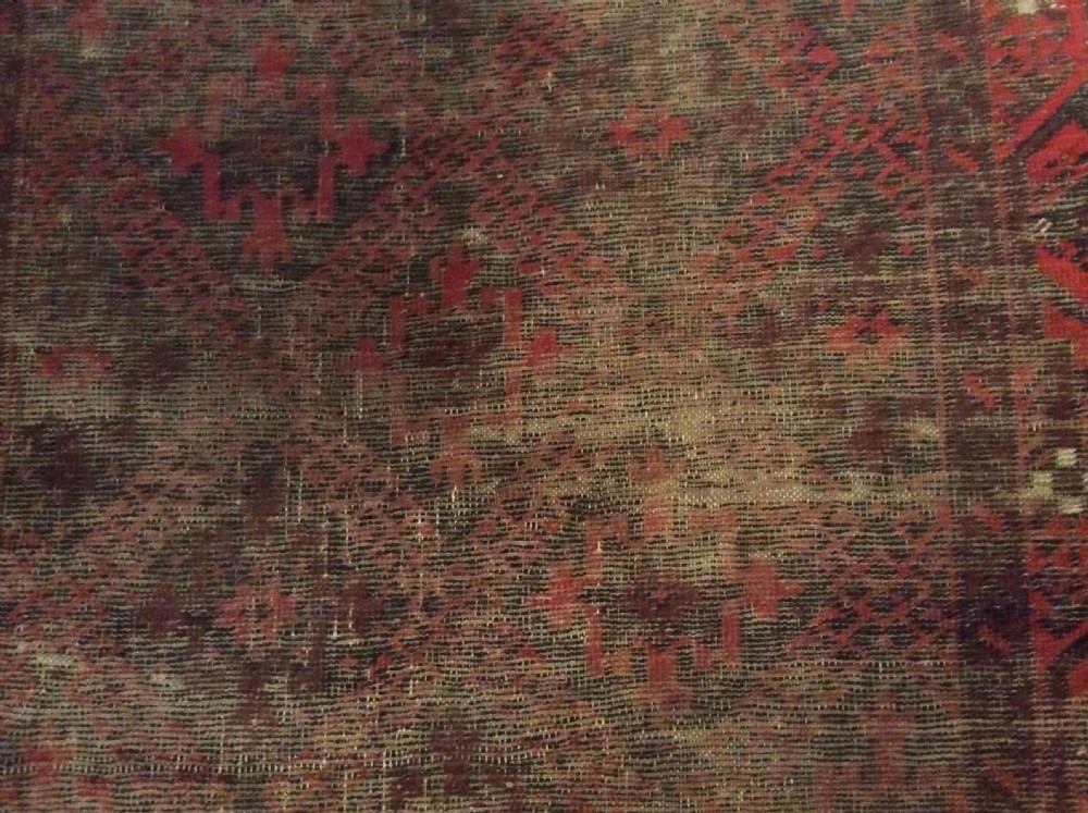 A well worn antique Afgan Baluch rug View XIII