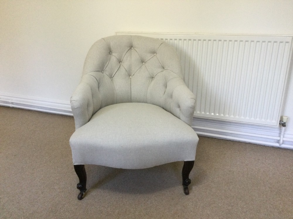 An English button back armchair