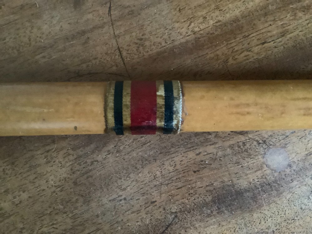 A wooden walking cane featuring a swirl-fluted hallmarked silver pommel top and silver collar. View VI