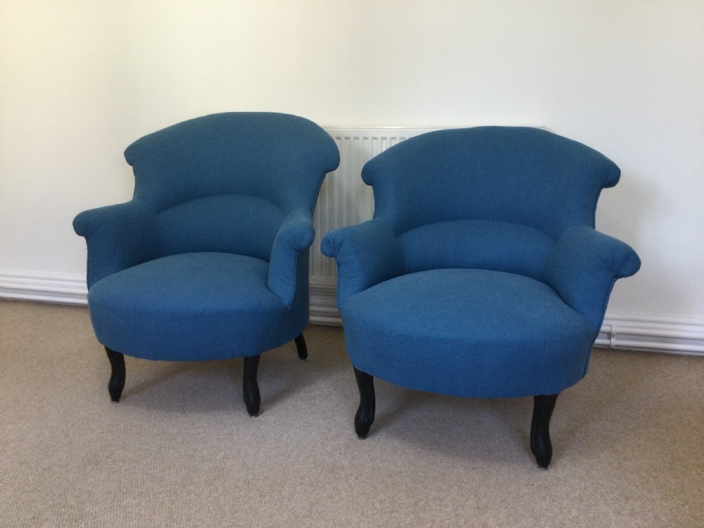 A 19th-century French crapaud armchair upholstered in teal blue fabric with dark wooden legs. View VII