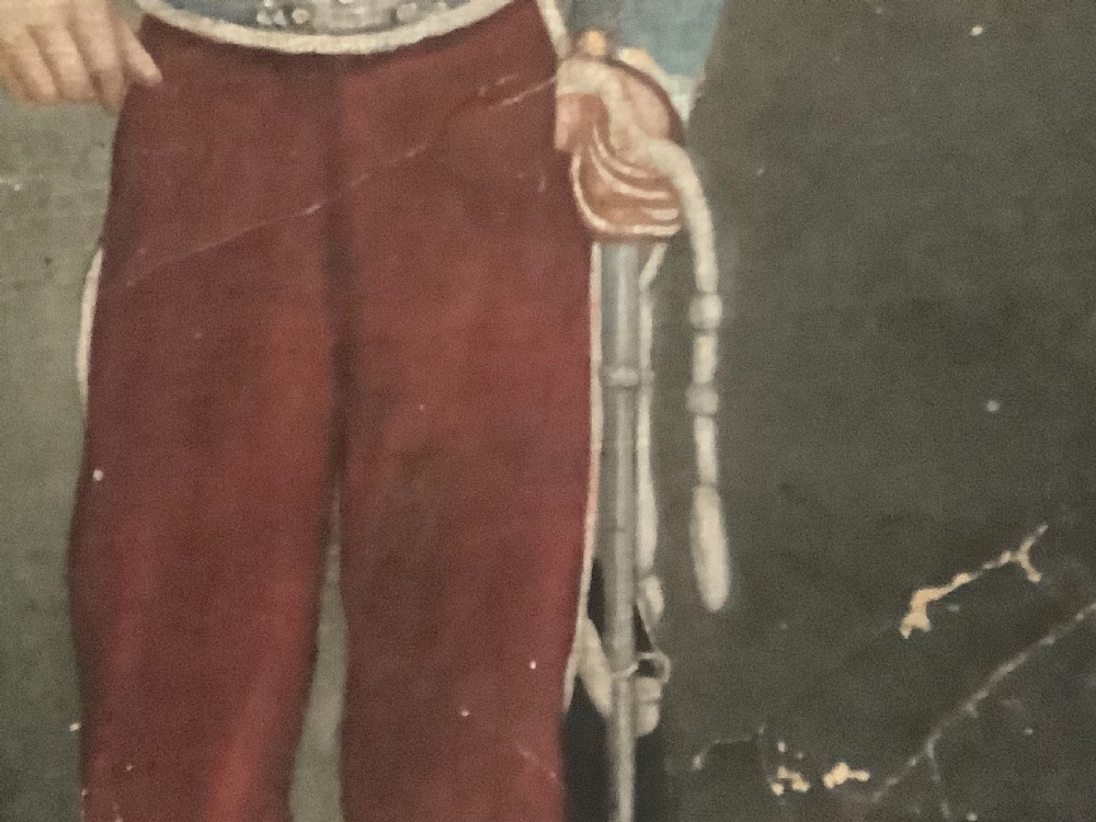 An antique full-length oil painting on canvas depicting a Hussar military officer standing in a braided blue uniform beside a pedestal. View IV