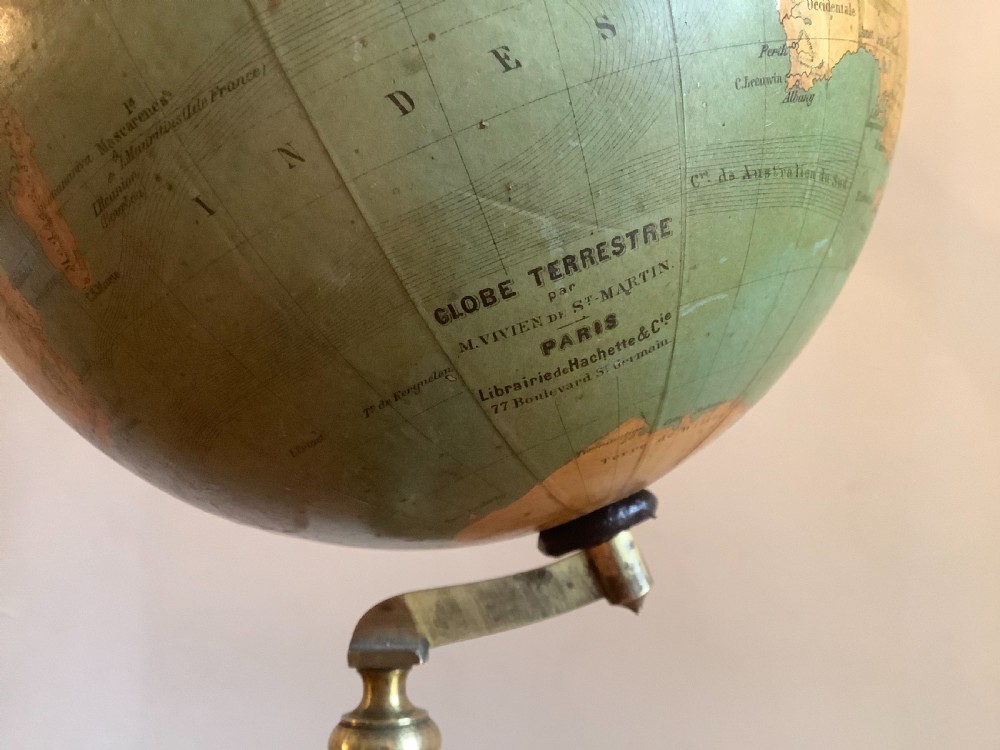 A small 19th-century French terrestrial globe with green oceans, mounted on a turned ebonised wood stand with brass fittings. View III