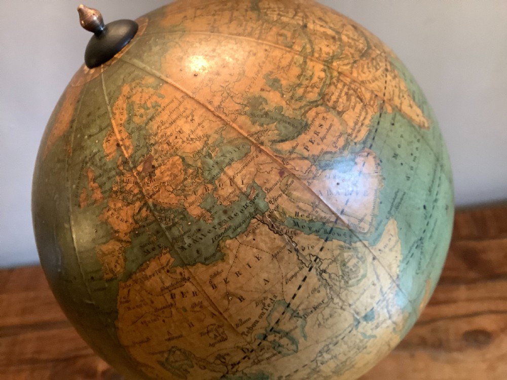 A small 19th-century French terrestrial globe with green oceans, mounted on a turned ebonised wood stand with brass fittings. View VI