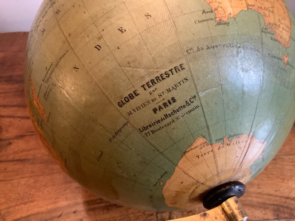 A small 19th-century French terrestrial globe with green oceans, mounted on a turned ebonised wood stand with brass fittings. View VIII