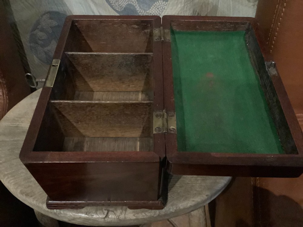 A rectangular Georgian mahogany tea caddy featuring a hinged lid, a brass top carrying handle, and an ornate brass keyhole escutcheon. View VIII