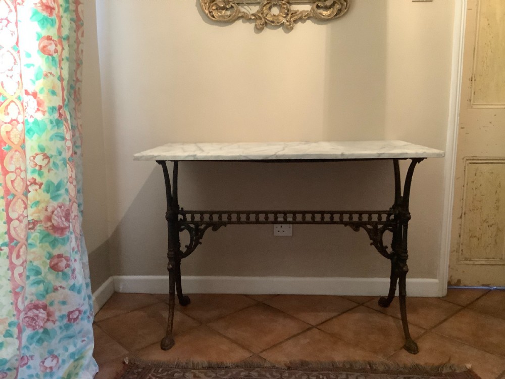 An English marble topped garden console table.
