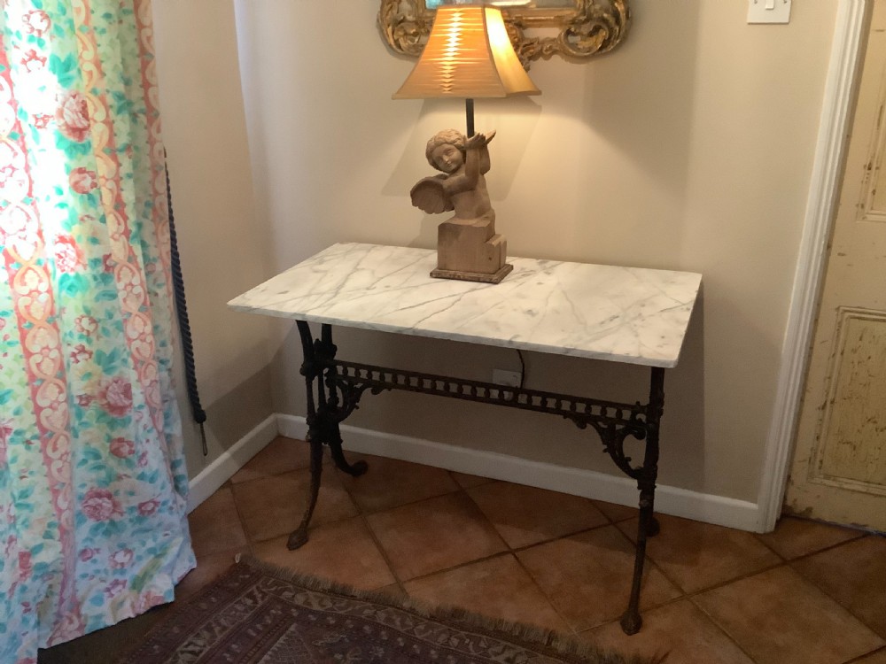 An English marble topped garden console table. View II