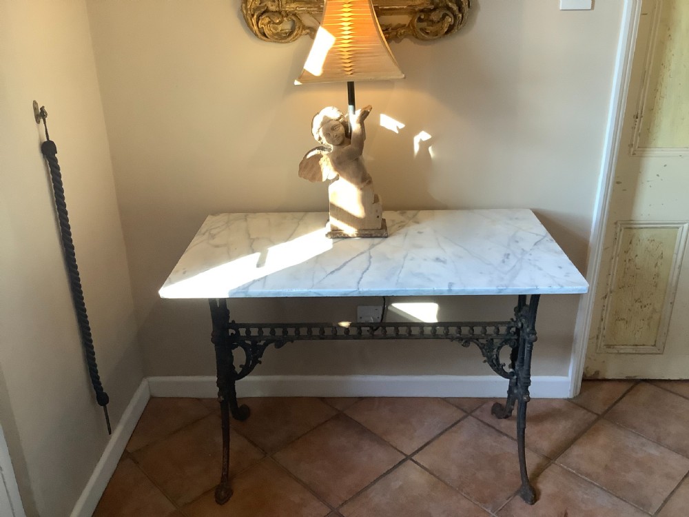 An English marble topped garden console table. View III