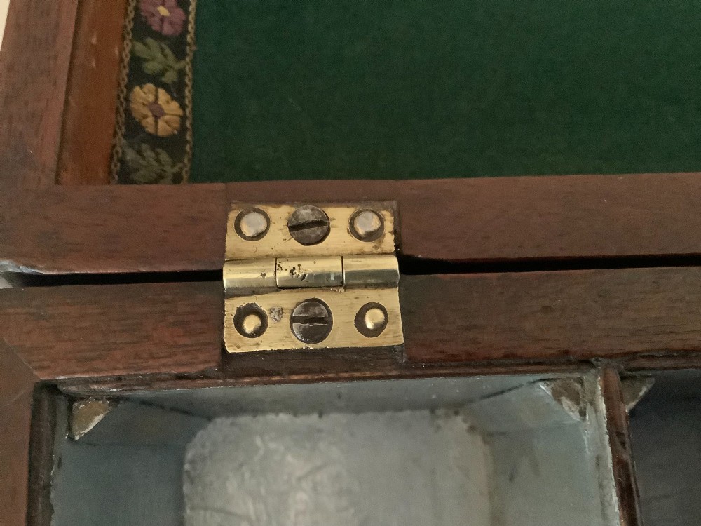 A Georgian mahogany tea caddy featuring brass ball-and-claw feet, a central brass escutcheon, and a top carrying handle. View XIII