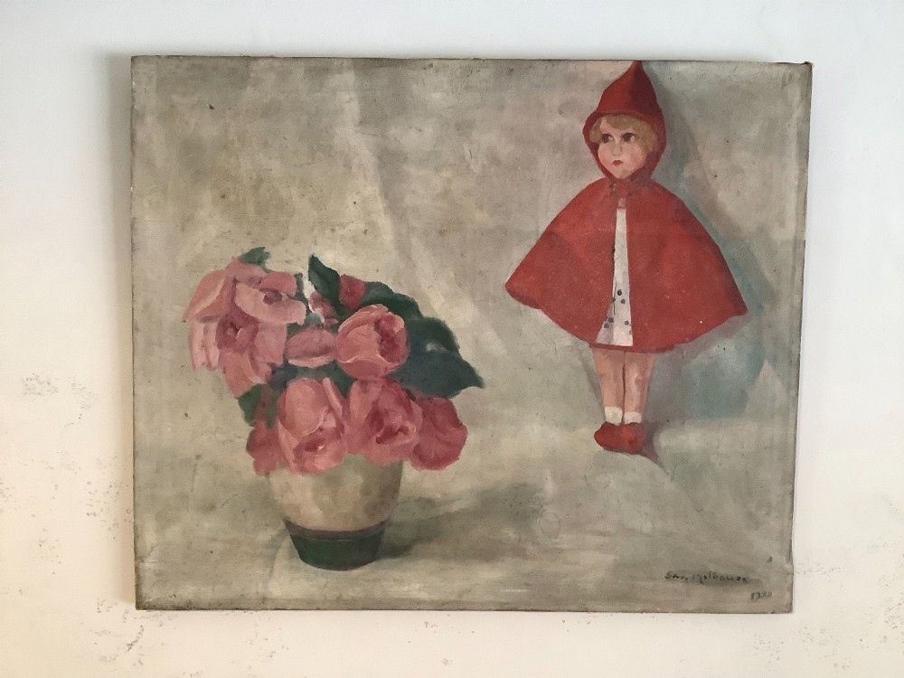 A 1928 naive oil painting depicting a red hooded doll figure alongside a ceramic vase with pink flowers against a muted grey background.