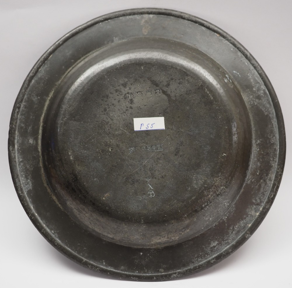 A circular grey antique pewter deep plate featuring a wide plain rim engraved with monogrammed initials at the top and the date 1845 at the bottom. View II