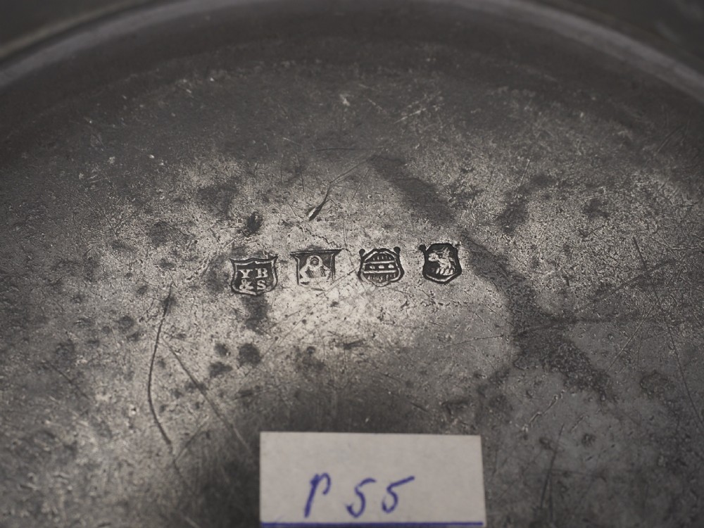 A circular grey antique pewter deep plate featuring a wide plain rim engraved with monogrammed initials at the top and the date 1845 at the bottom. View VI