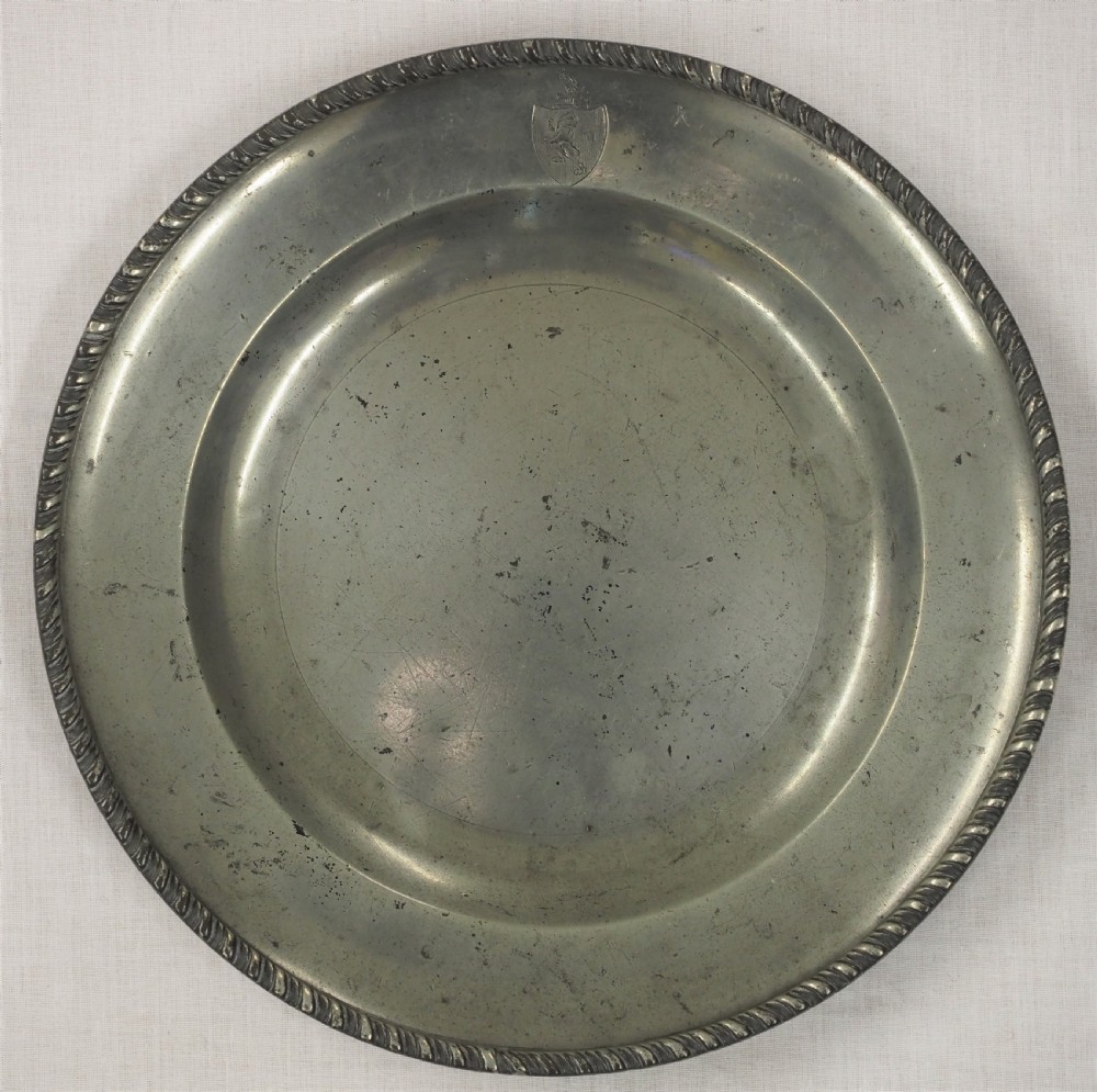 GEORGE II PEWTER PLATE WITH GADROONED EDGE BY JOHN CARPENTER, LONDON CIRCA 1740.