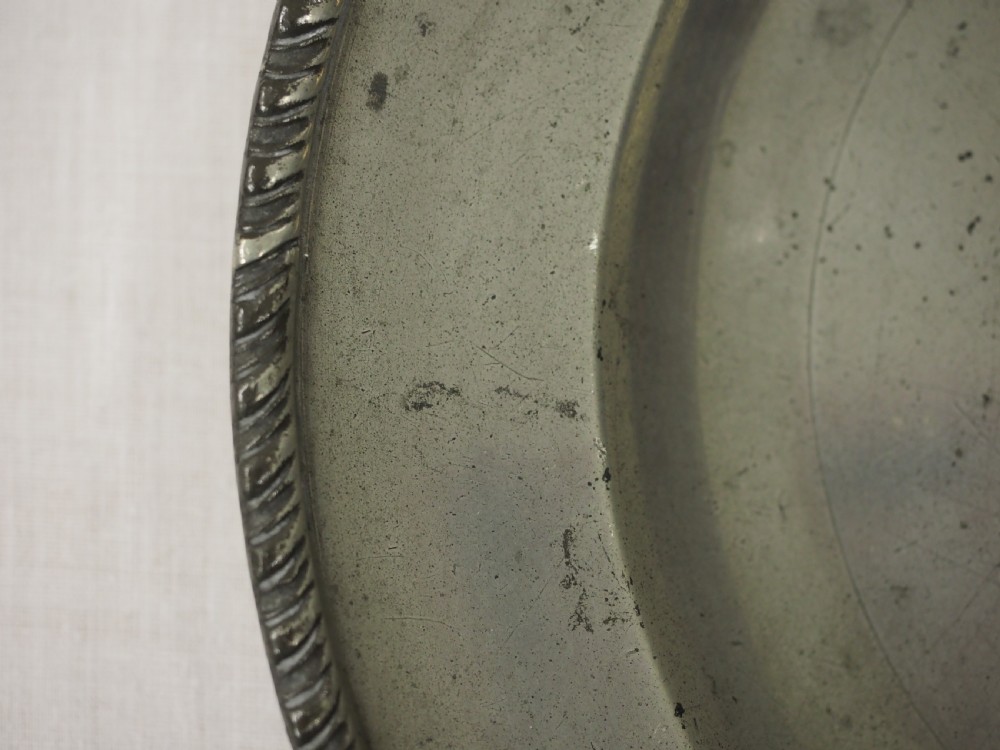 GEORGE II PEWTER PLATE WITH GADROONED EDGE BY JOHN CARPENTER, LONDON CIRCA 1740. View IV