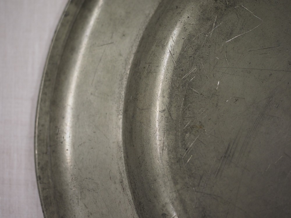 GEORGE II PEWTER PLATE WITH GADROONED EDGE BY JOHN CARPENTER, LONDON CIRCA 1740. View VII