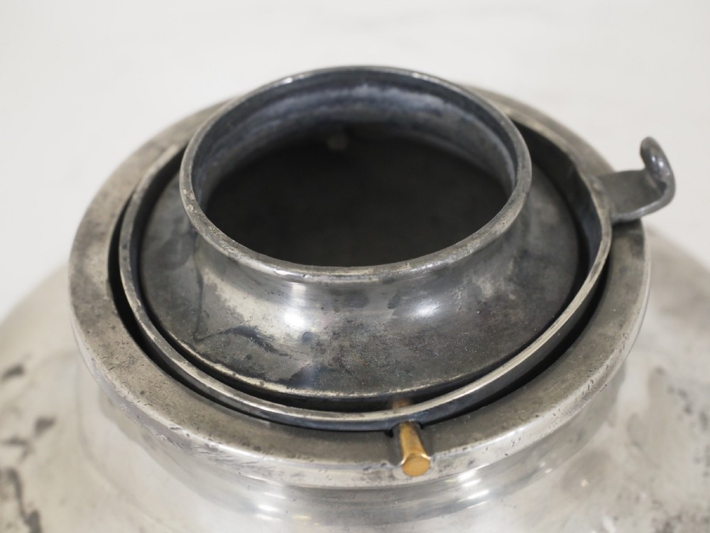 An antique pewter ships inkwell featuring a wide circular capstan base and a domed lid. View VI