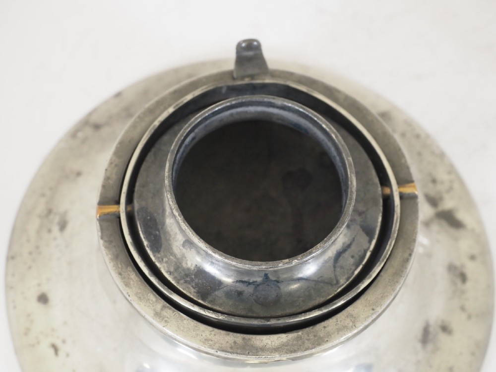 An antique pewter ships inkwell featuring a wide circular capstan base and a domed lid. View VIII