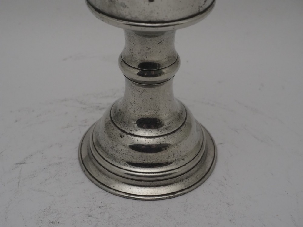 An 18th-century pewter chalice featuring a flared cylindrical cup, a turned central knopped stem, and a stepped circular spreading base. View III