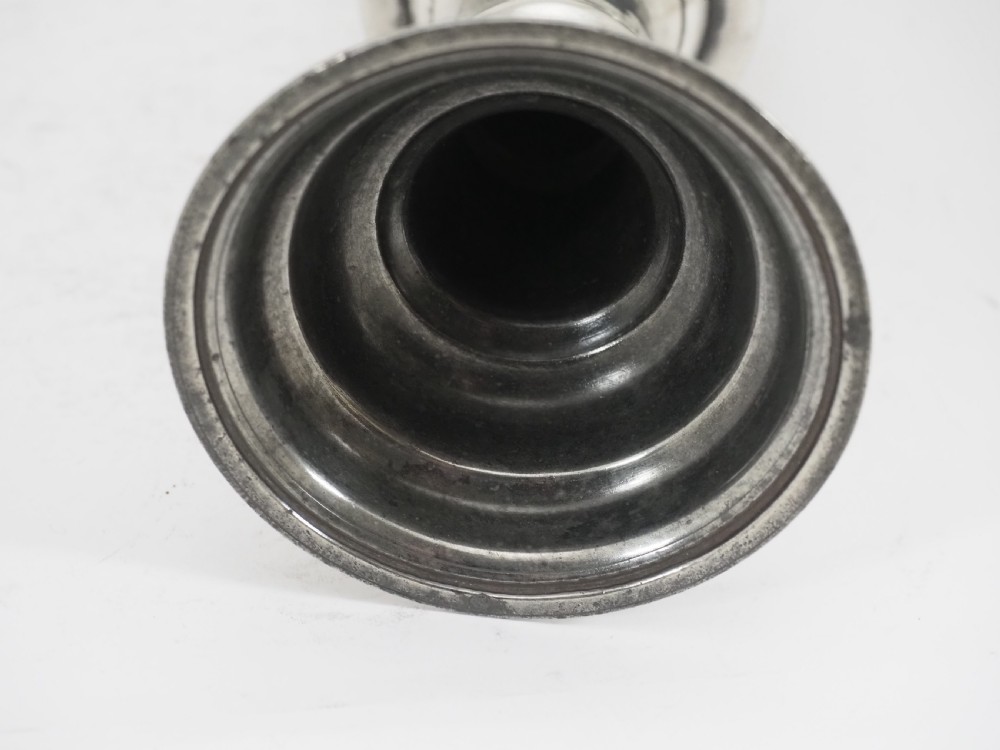An 18th-century pewter chalice featuring a flared cylindrical cup, a turned central knopped stem, and a stepped circular spreading base. View VI