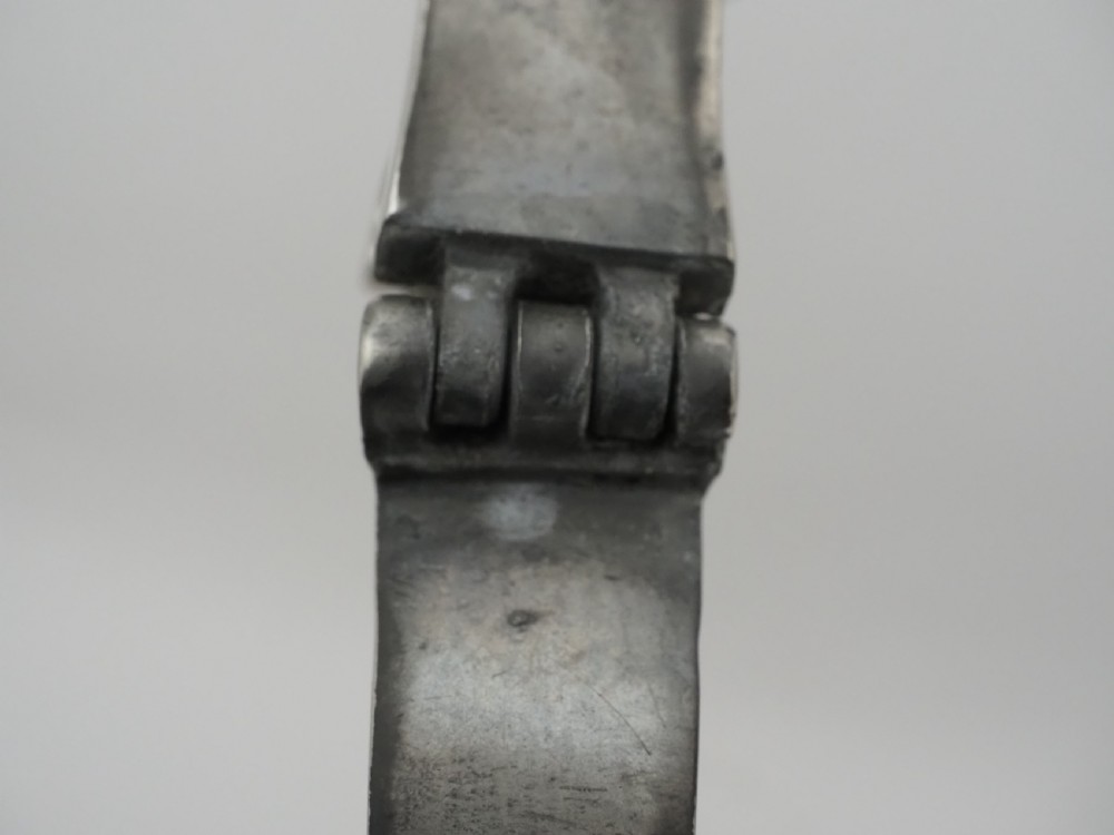 An 18th-century Georgian Irish pewter church flagon featuring a domed hinged lid, double-scroll handle, spout, and circular moulded base. View XIII