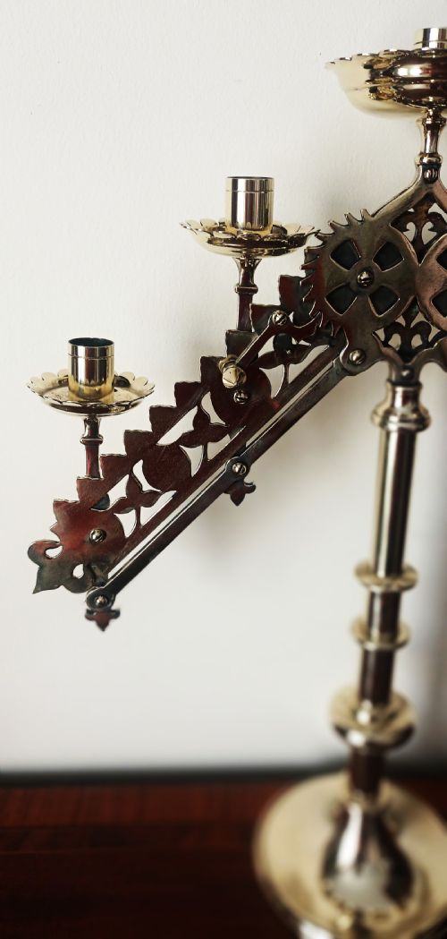 fig 2. An English Victorian brass five-light articulated candelabra with an adjustable gear mechanism and Gothic pierced arms.