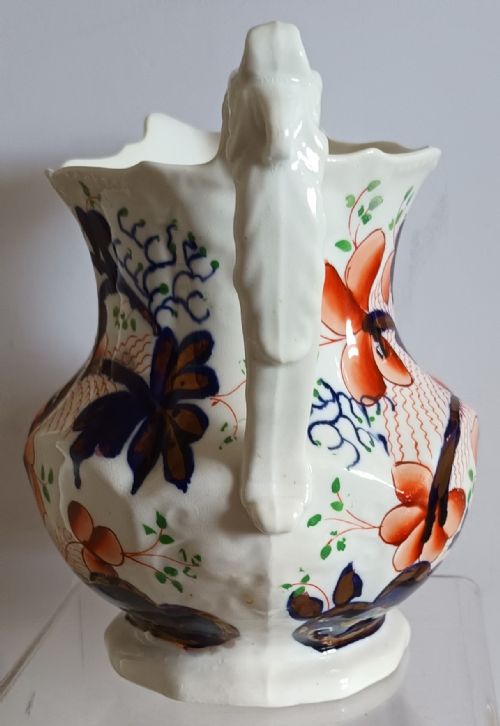 fig 1. Victorian Gaudy Welsh earthenware jug decorated with hand-painted cobalt blue and rust-orange floral motifs and a moulded handle.