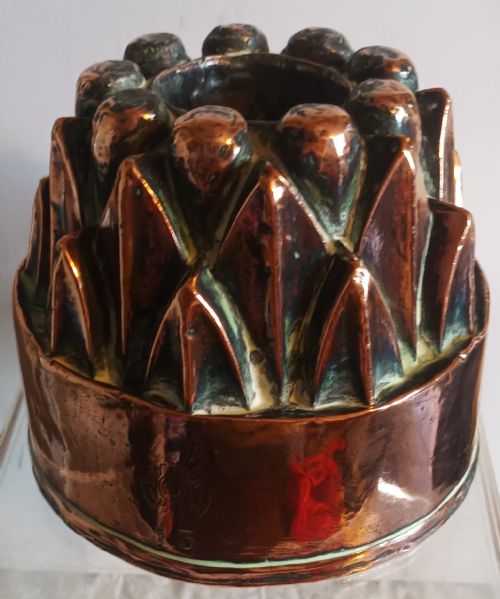 fig 1. An antique nineteenth-century French fluted copper jelly mould stamped with the Trottier maker mark.