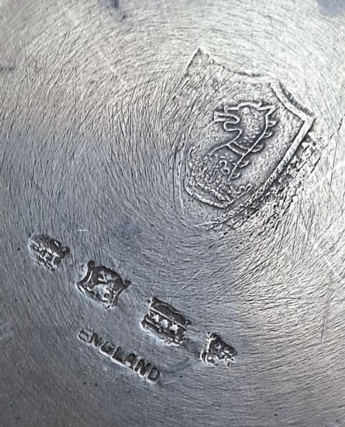 fig 1. A set of six circular antique pewter plates displaying aged dark grey patination and flat rims.