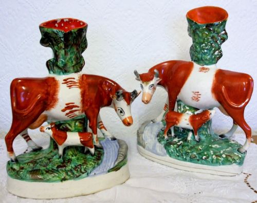 PAIR OF ANTIQUE ENGLISH VICTORIAN STAFFORDSHIRE POTTERY COW AND CALF SPILL VASES
