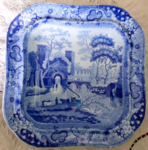 fig 2. An antique Georgian blue and white transferware vegetable tureen cover featuring a castle landscape scene and ornate floral border.