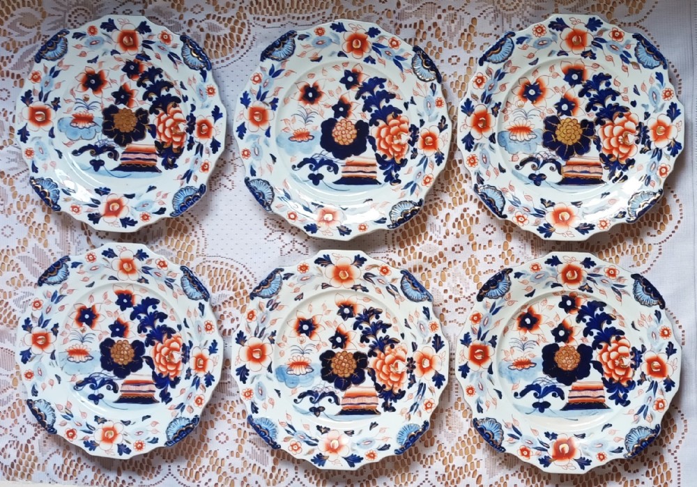 Set of six scalloped Georgian ironstone china plates decorated in a blue, orange, and gilt Japan pattern with floral motifs.