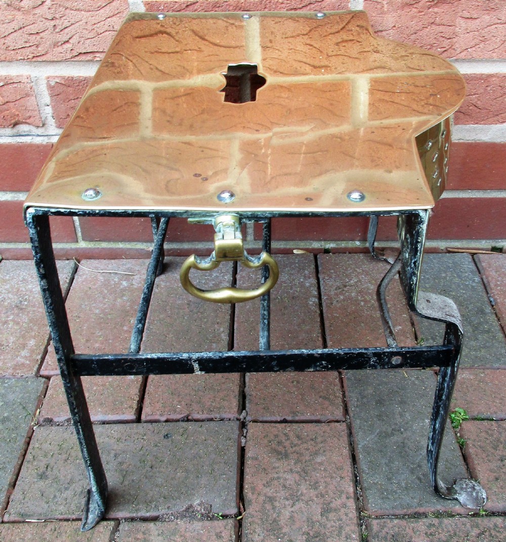 An antique Georgian brass and steel fireplace footman stand with a pierced lattice apron, cabriole front legs, and top carrying handle. View III