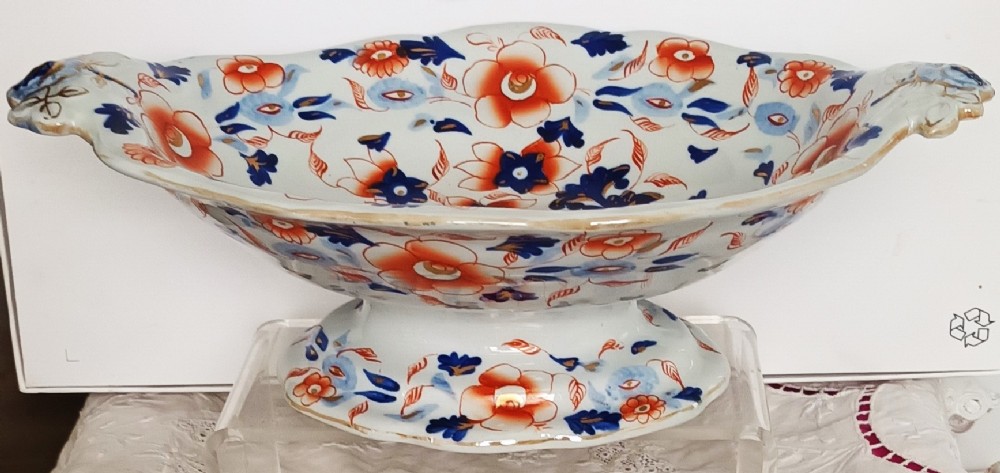 An antique Georgian ironstone footed comport featuring a hand-painted Japan pattern in cobalt blue and rust orange with twin side handles.