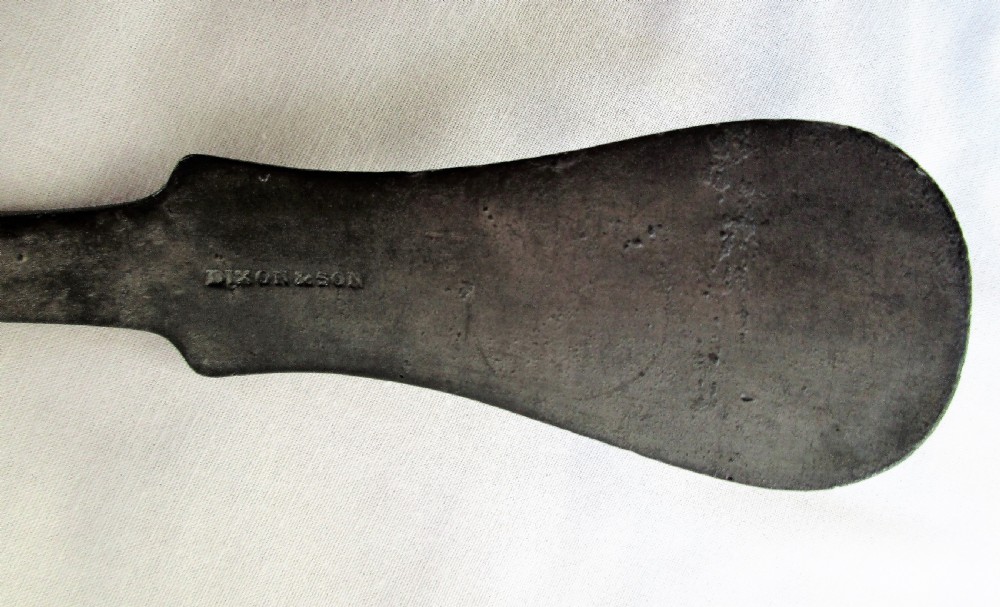 An antique Georgian pewter ladle featuring a rounded deep bowl and a long flattened handle stem. View III