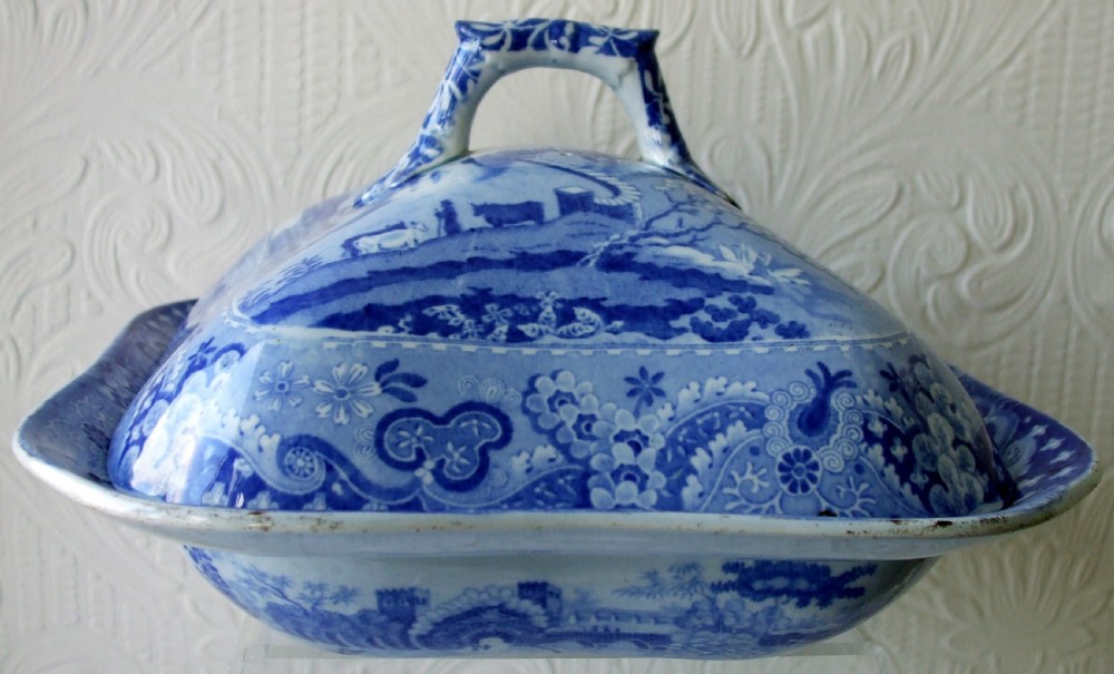 An antique Georgian blue and white transferware vegetable tureen cover featuring a castle landscape scene and ornate floral border. View II