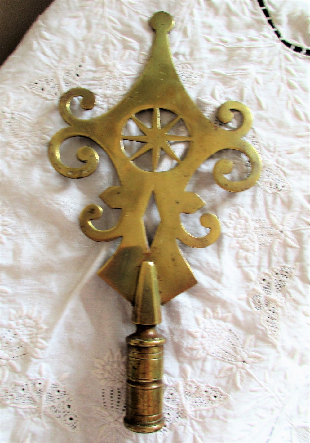 An antique Victorian cast brass friendly society pole head featuring a central star motif within a circular cut-out surrounded by pierced scrollwork and a hollow mounting socket at the base. View III
