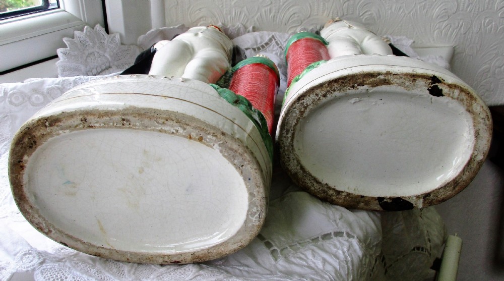 A pair of antique Victorian Staffordshire earthenware portrait figures depicting Moody and Sankey standing beside red pillars with moulded bases. View VI