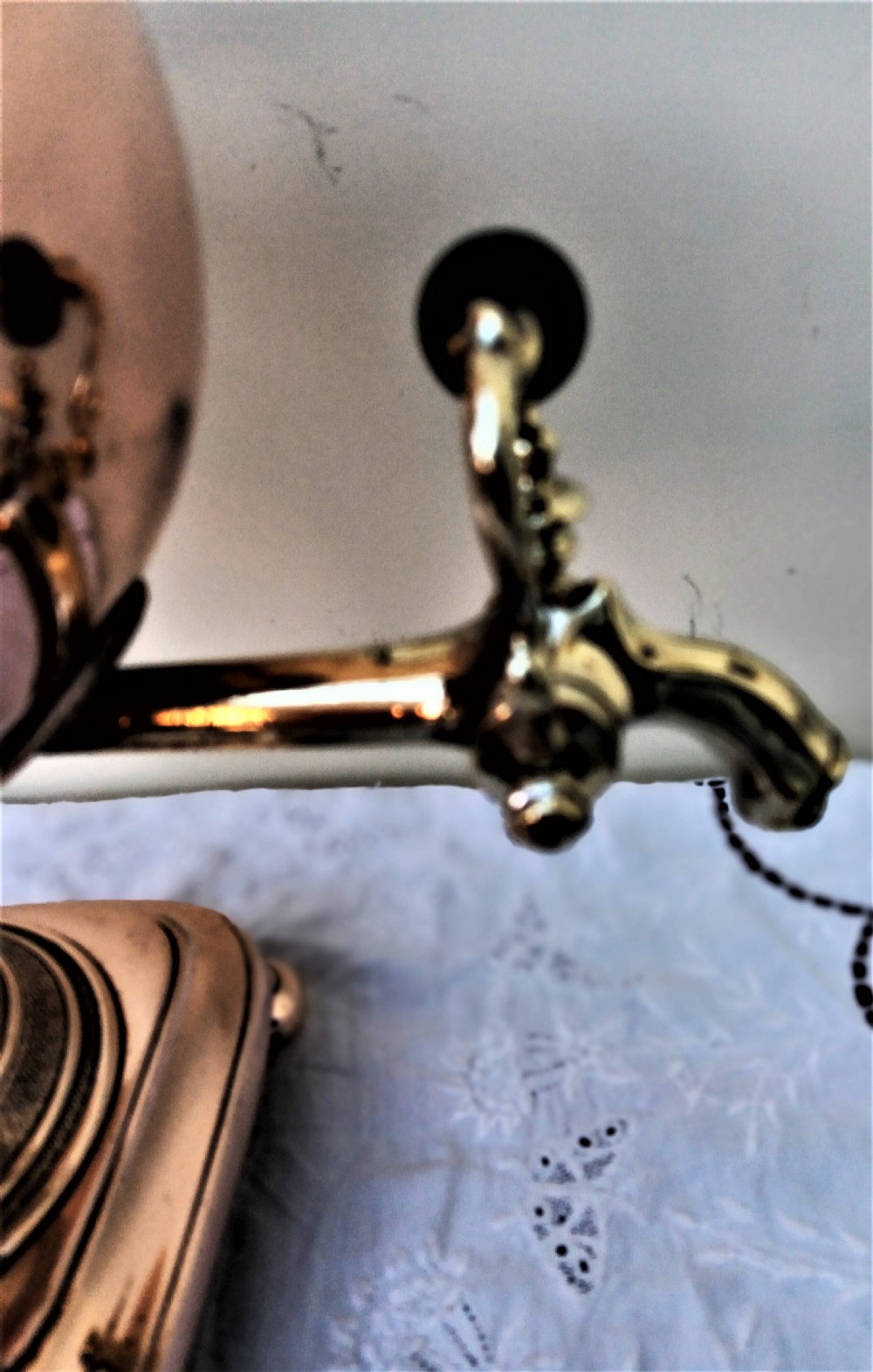 A polished Georgian copper tea urn featuring twin reeded handles, a brass spigot tap, and a square pedestal base resting on ball feet. View XI