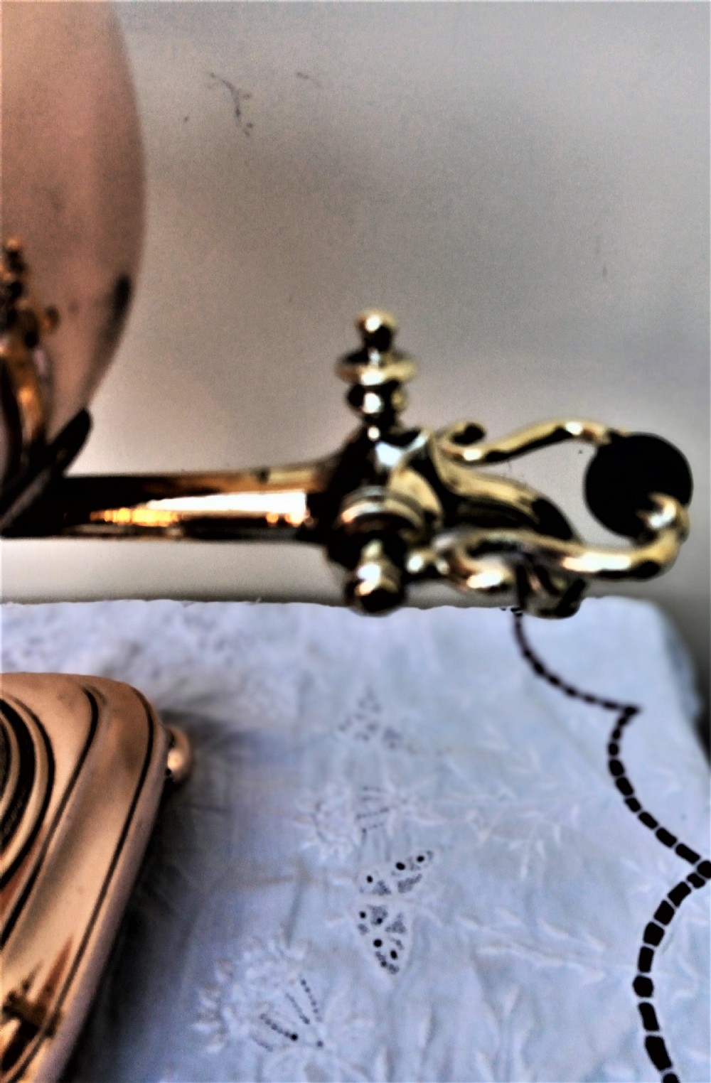 A polished Georgian copper tea urn featuring twin reeded handles, a brass spigot tap, and a square pedestal base resting on ball feet. View XII