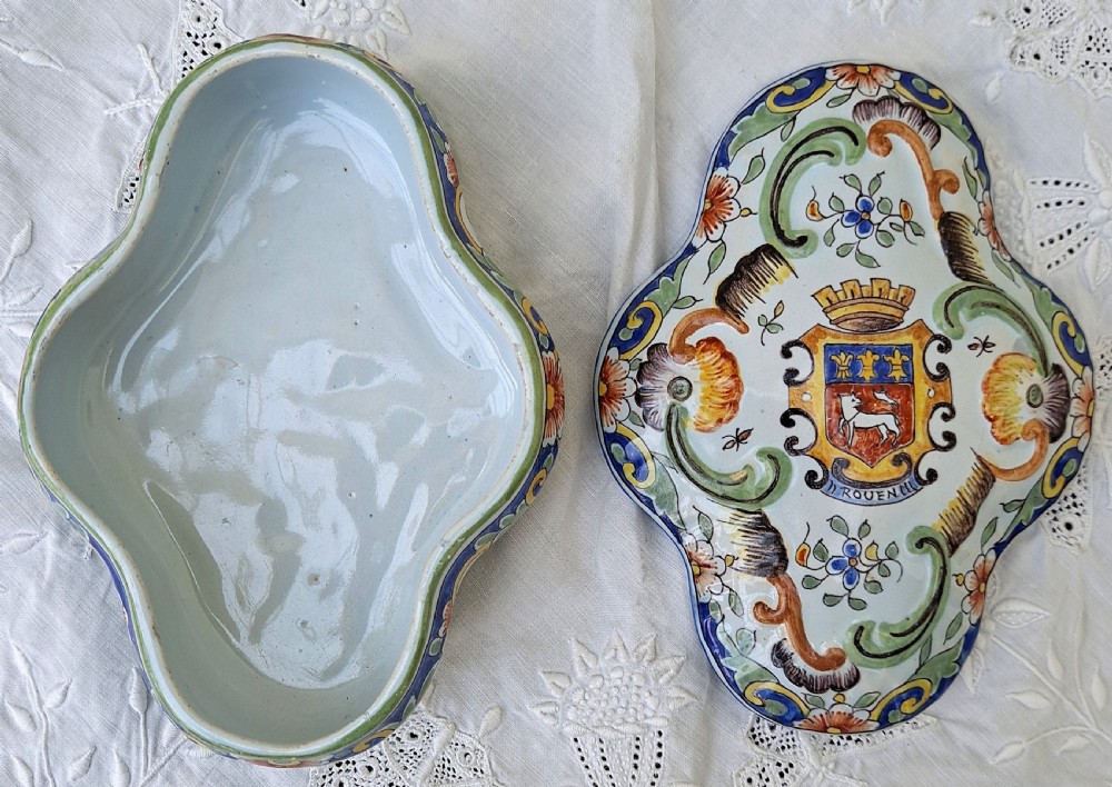 A shaped hand-painted French faience lidded trinket box with polychrome scroll and floral decoration on an off-white glaze. View III